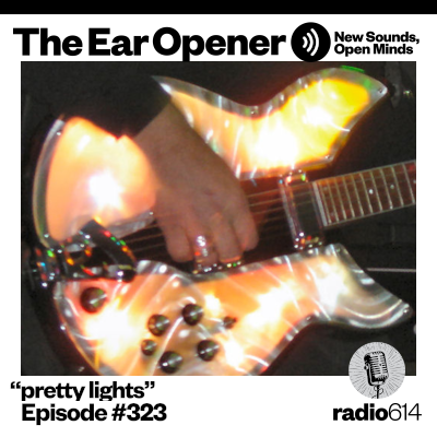 Electric guitar reflecting multi-colored lights